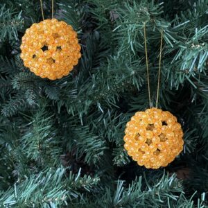Handmade orange beaded Christmas bauble citrus-inspired ornament UK