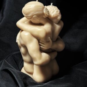 Romantic couple candle handmade from soy wax sculpted as two embracing bodies
