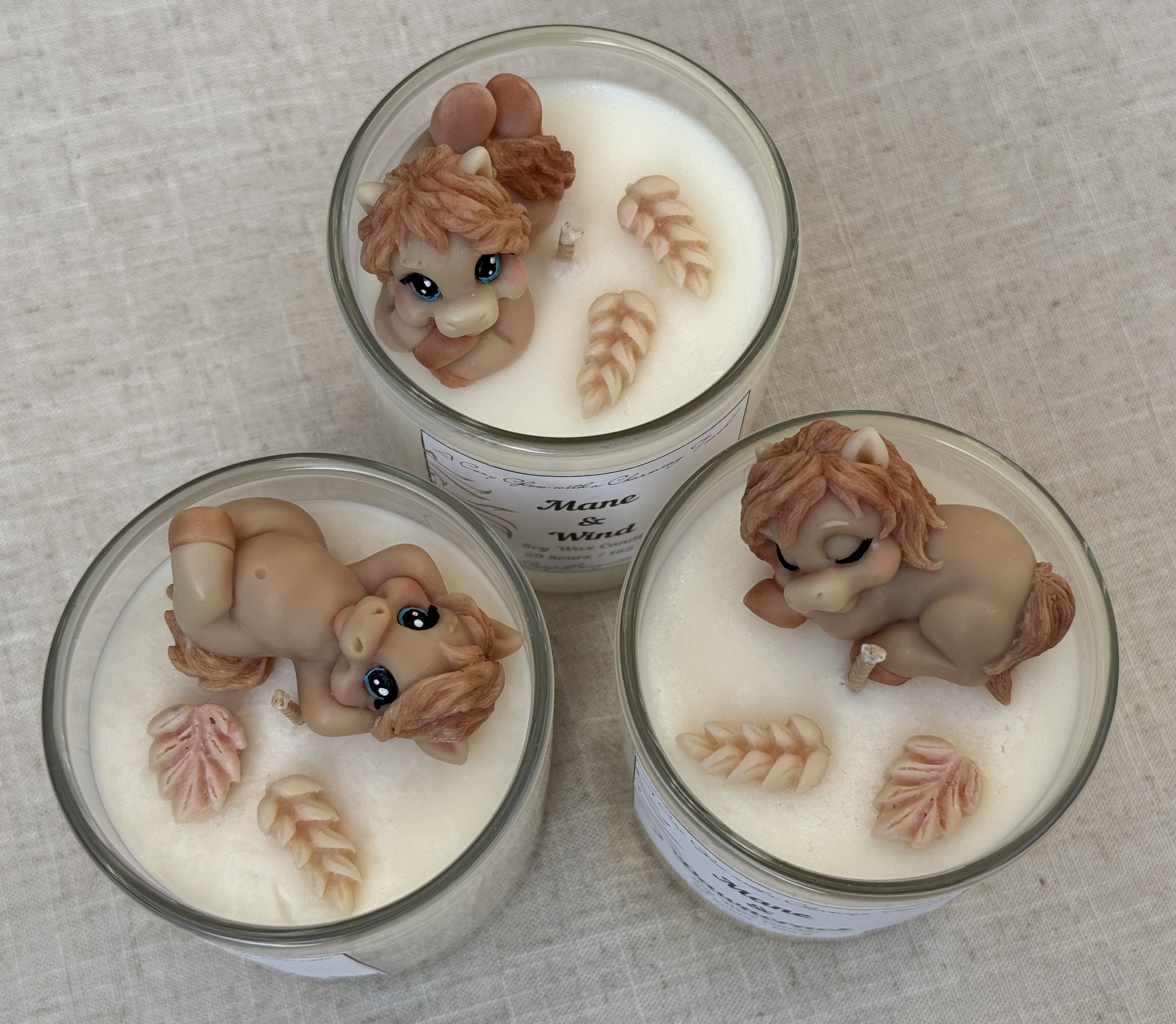 Three handmade soy horse candle designs for horse lovers