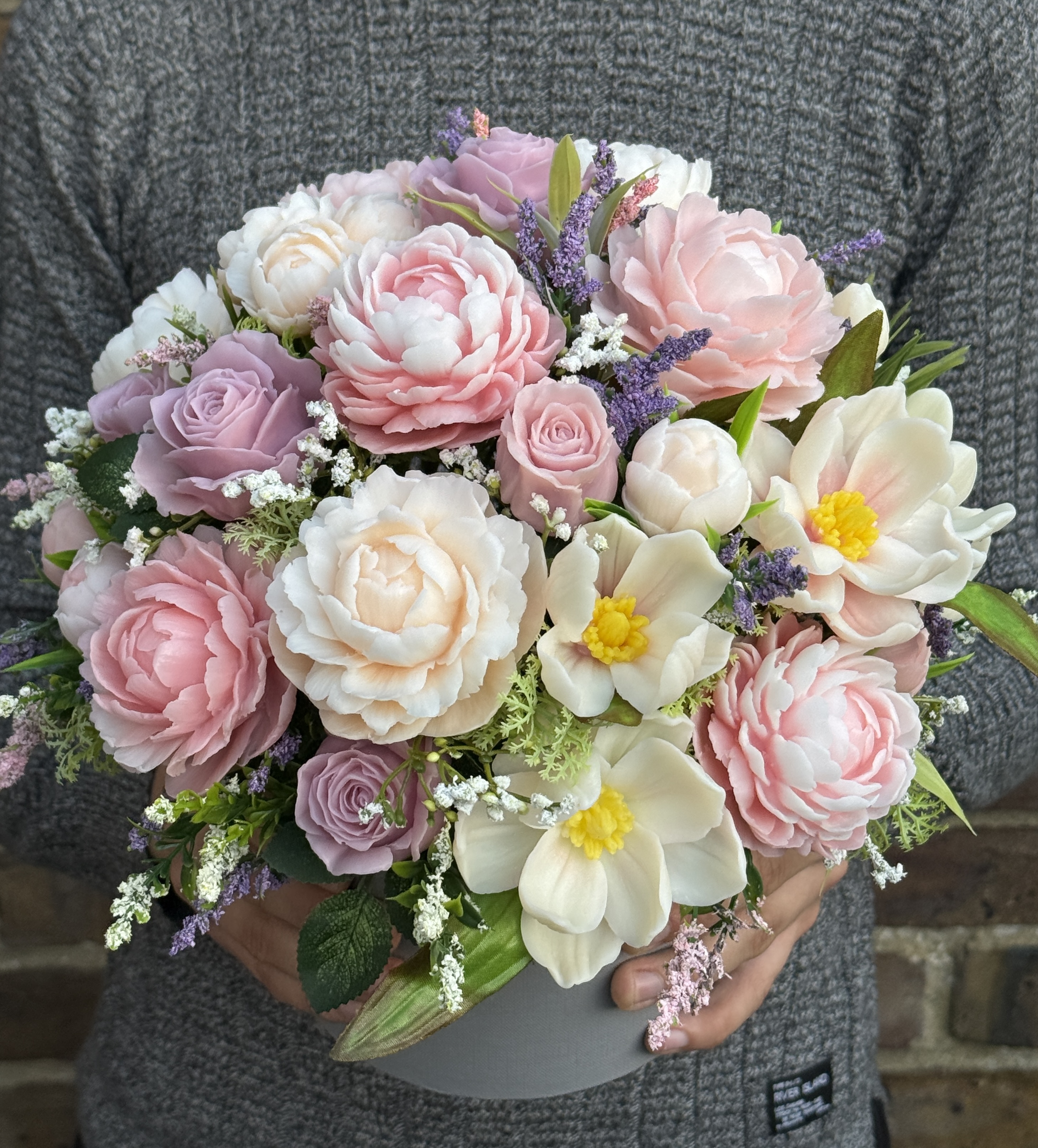 Large pastel soap flower bouquet held in both hands to show its 29 × 30 cm size.